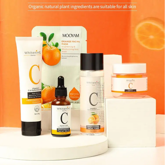 A set of brightening vitamin c cleanser, toner, sheet mask, serum, and face cream